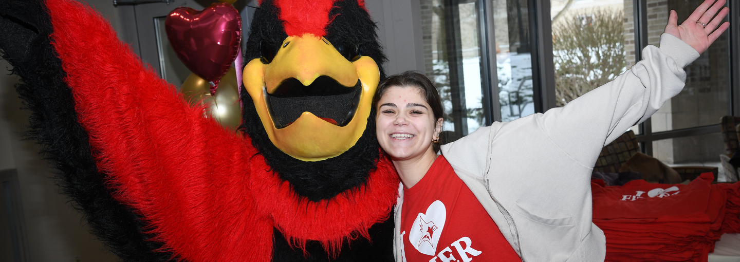 Cardinal and a student celebrate I Heart ̳ Giving Day